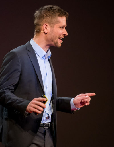 Peter Hajdu giving a TEDx talk. Public speaking.
