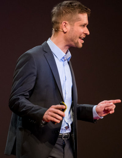 Peter Hajdu delivering his TEDx talk at TEDxMetropolitanUniversity in 2017.